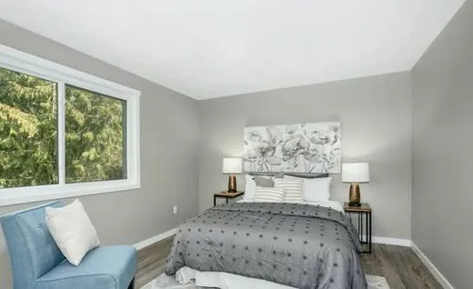 Bedroom remodel with new window trim and flooring